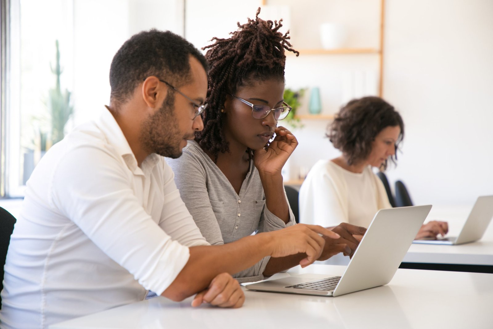 Instructor Explaining Corporate Software Specific To Intern